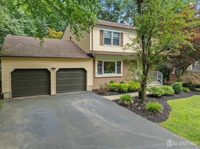 20 Buffalo Run, East Brunswick, NJ 08816 - traditional-style home with asphalt driveway, a garage, and brick siding