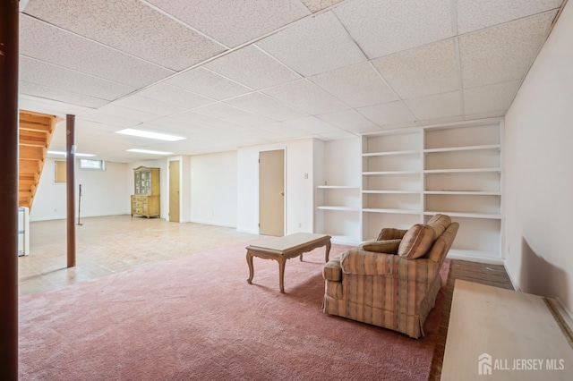 20 Buffalo Run, East Brunswick, NJ 08816 - sitting room with built in shelves, carpet, and a drop ceiling