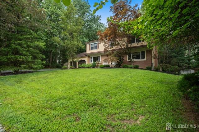 20 Buffalo Run, East Brunswick, NJ 08816 - view of front of house featuring a front yard and a garage