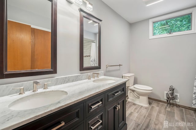 20 Buffalo Run, East Brunswick, NJ 08816 - full bathroom featuring double vanity and wood finished floors