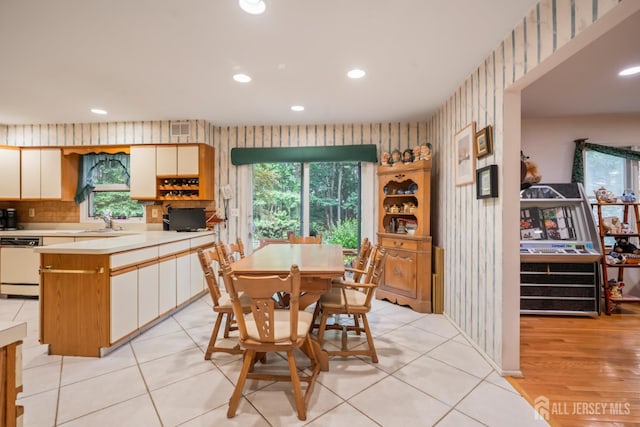 20 Buffalo Run, East Brunswick, NJ 08816 - dining space with wallpapered walls, recessed lighting, and plenty of natural light