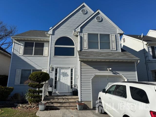 view of front of property featuring a garage