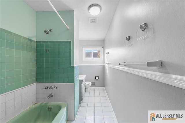 bathroom featuring toilet, vanity, and tile patterned floors