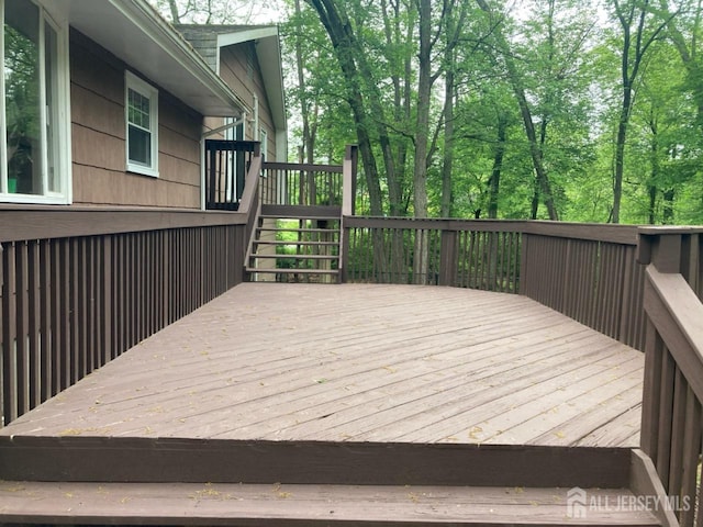 wooden terrace featuring stairs
