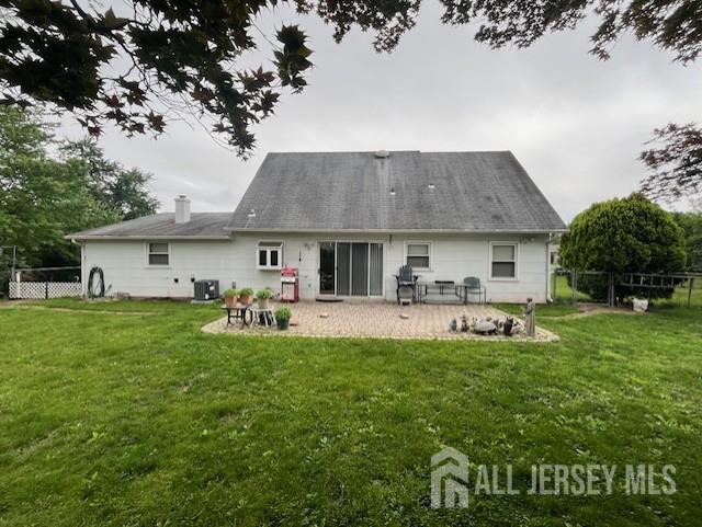 12 Landry Rd, Franklin, NJ 08873 - rear view of house featuring central AC and a patio
