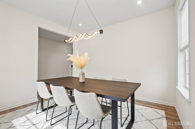 dining space with light wood finished floors, recessed lighting, and baseboards