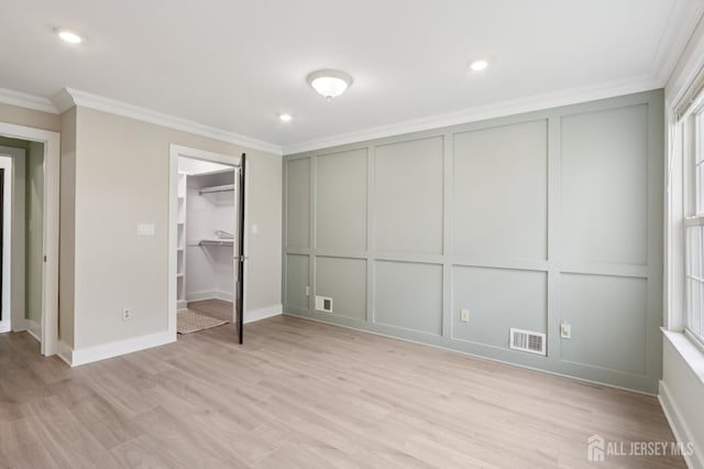 101 Country Club Dr Unit 6, Union Twp, NJ 07083 - unfurnished bedroom featuring a decorative wall, ornamental molding, light wood-style floors, recessed lighting, and multiple windows