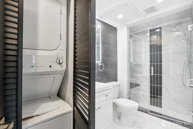 101 Country Club Dr Unit 6, Union Twp, NJ 07083 - bathroom with stacked washer and clothes dryer, a shower stall, and vanity