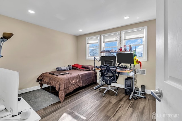 bedroom with hardwood / wood-style flooring