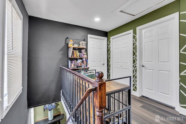 hallway featuring hardwood / wood-style floors and a wealth of natural light