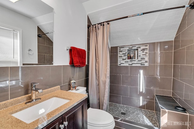 bathroom featuring toilet, a shower with curtain, tile walls, vanity, and backsplash