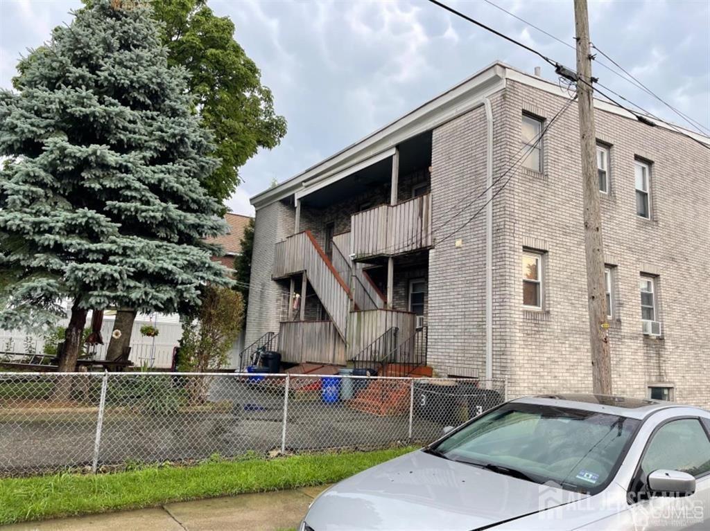 82 Pulaski Ave, Carteret, NJ 07008 - view of building exterior featuring a fenced front yard