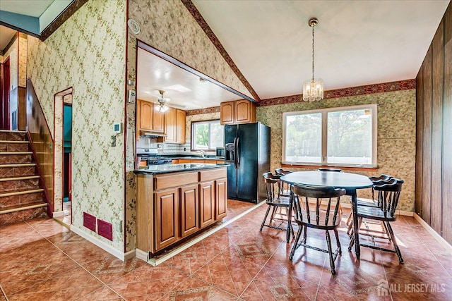 14 Mcginnis Rd, Edison, NJ 08817 - kitchen featuring black refrigerator with ice dispenser, wallpapered walls, under cabinet range hood, gas range, and a chandelier