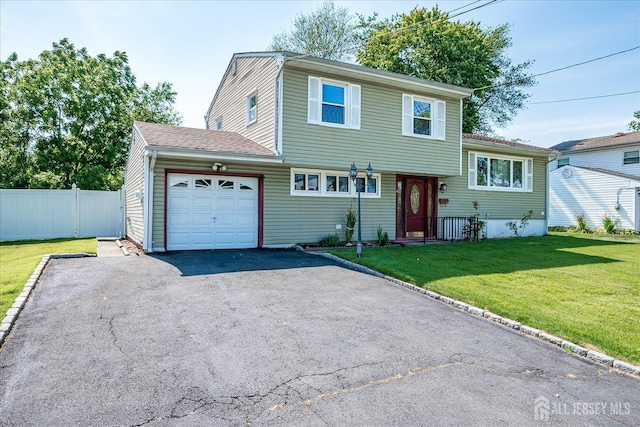 14 Mcginnis Rd, Edison, NJ 08817 - tri-level home featuring asphalt driveway and an attached garage