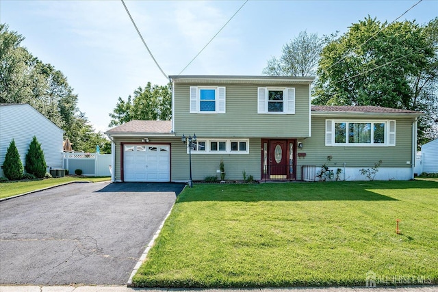 14 Mcginnis Rd, Edison, NJ 08817 - tri-level home featuring asphalt driveway and a garage