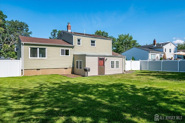 14 Mcginnis Rd, Edison, NJ 08817 - rear view of house featuring crawl space and a chimney