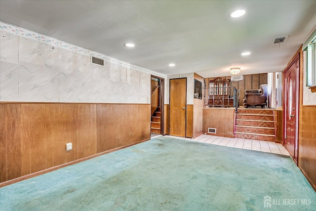 14 Mcginnis Rd, Edison, NJ 08817 - unfurnished living room featuring stairway, wooden walls, carpet, wainscoting, and recessed lighting