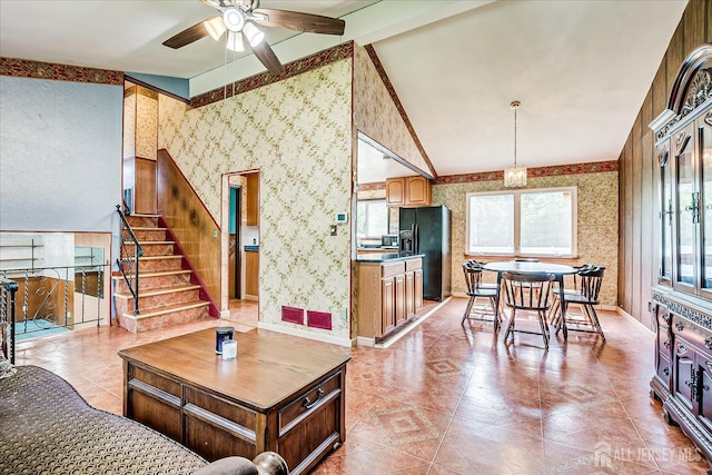 14 Mcginnis Rd, Edison, NJ 08817 - living room with wallpapered walls, ceiling fan, vaulted ceiling, stairway, and light tile patterned floors