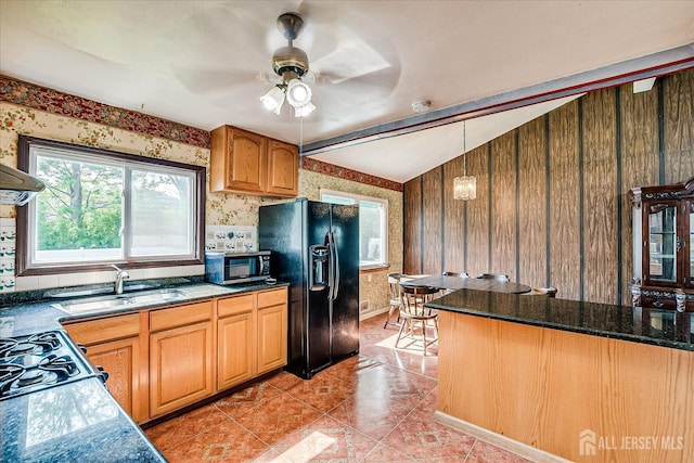 14 Mcginnis Rd, Edison, NJ 08817 - kitchen featuring black fridge with ice dispenser, stainless steel microwave, wallpapered walls, ceiling fan, and dark countertops