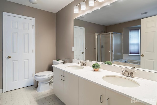 full bathroom featuring tile patterned floors, vanity, independent shower and bath, and toilet