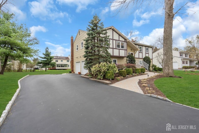423 Brentwood Dr, Piscataway, NJ 08854 - view of property featuring driveway and a garage