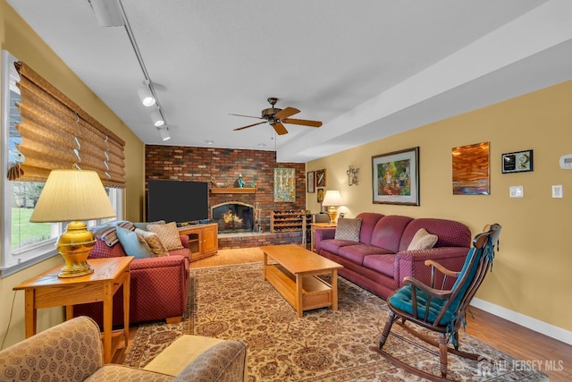 423 Brentwood Dr, Piscataway, NJ 08854 - living room featuring ceiling fan, wood finished floors, baseboards, and a fireplace