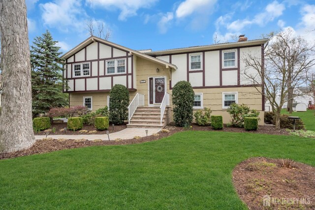 423 Brentwood Dr, Piscataway, NJ 08854 - view of front of house featuring a chimney and a front lawn