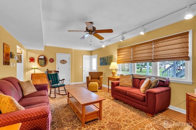 423 Brentwood Dr, Piscataway, NJ 08854 - living area with rail lighting, a ceiling fan, light wood-type flooring, and baseboards
