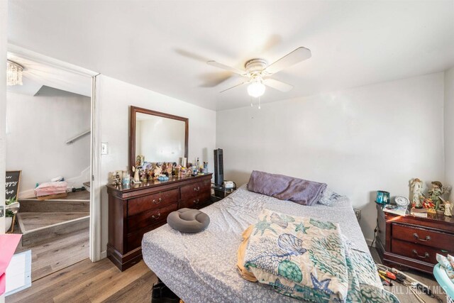 bedroom with ceiling fan and light wood-type flooring