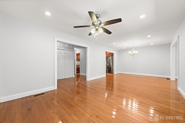 15-A Betsy Ross Dr, Monroe, NJ 08831 - unfurnished living room featuring a chandelier, a ceiling fan, recessed lighting, baseboards, and light wood-style flooring