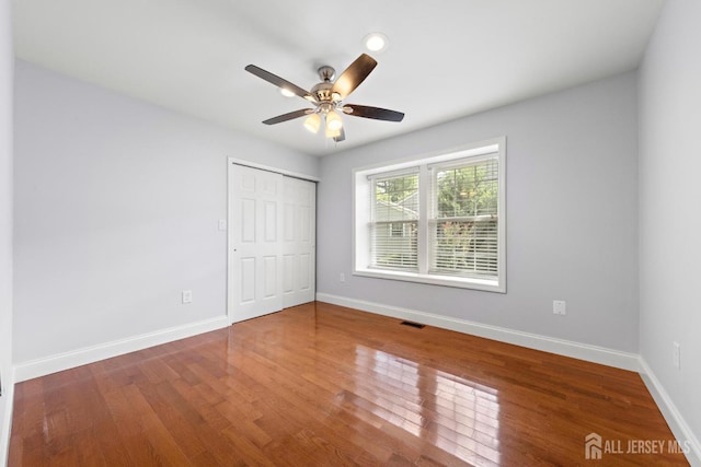 15-A Betsy Ross Dr, Monroe, NJ 08831 - unfurnished bedroom featuring baseboards, wood finished floors, a closet, and a ceiling fan