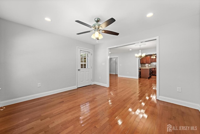 15-A Betsy Ross Dr, Monroe, NJ 08831 - unfurnished living room featuring ceiling fan, a chandelier, light wood-type flooring, baseboards, and recessed lighting