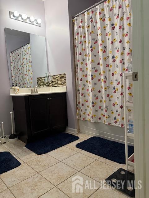 437 NE Micali Way S, Plainfield, NJ 07080 - bathroom with vanity, tile patterned flooring, and shower / tub combo