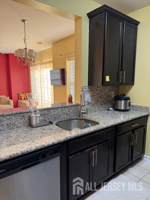 437 NE Micali Way S, Plainfield, NJ 07080 - kitchen featuring dishwasher, a chandelier, light tile patterned floors, and light stone counters