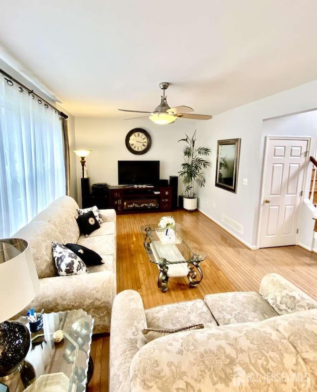 57 Yorktown Rd, South Brunswick, NJ 08852 - living room featuring a ceiling fan and wood-type flooring