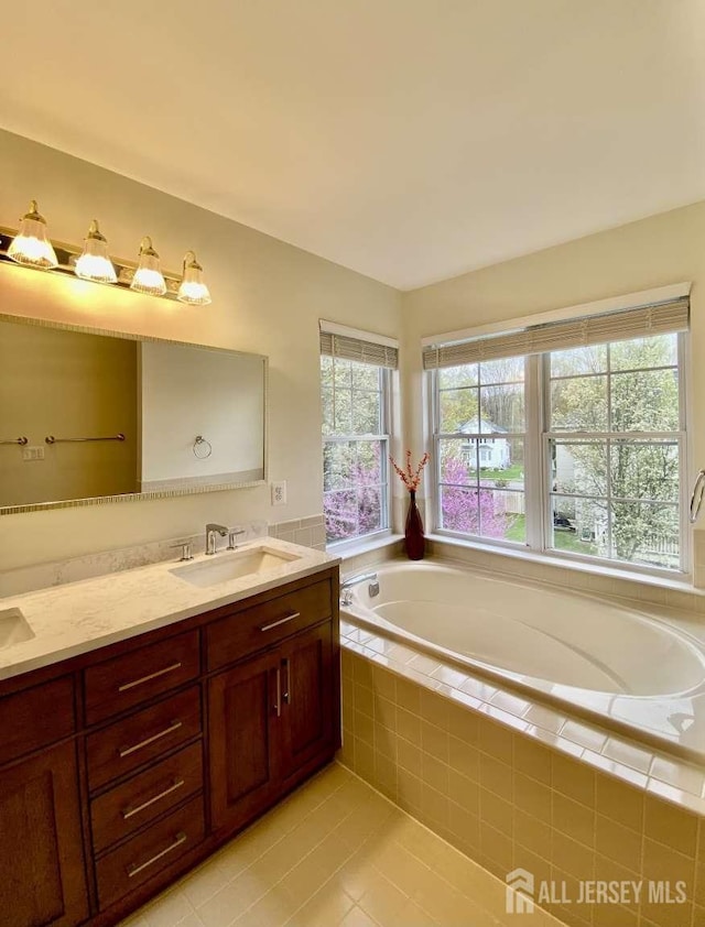 57 Yorktown Rd, South Brunswick, NJ 08852 - bathroom with double vanity, a bath, and tile patterned flooring