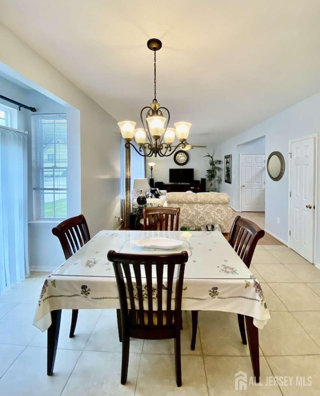 57 Yorktown Rd, South Brunswick, NJ 08852 - dining space with a chandelier and light tile patterned floors