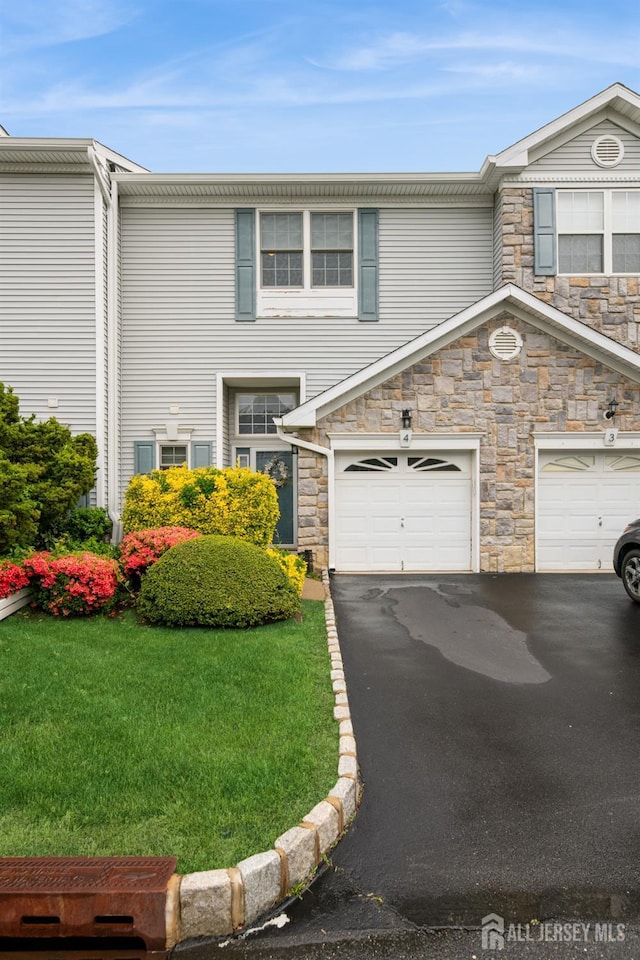4 Linda Ct, Old Bridge, NJ 08879 - view of property featuring stone siding, asphalt driveway, and a front yard