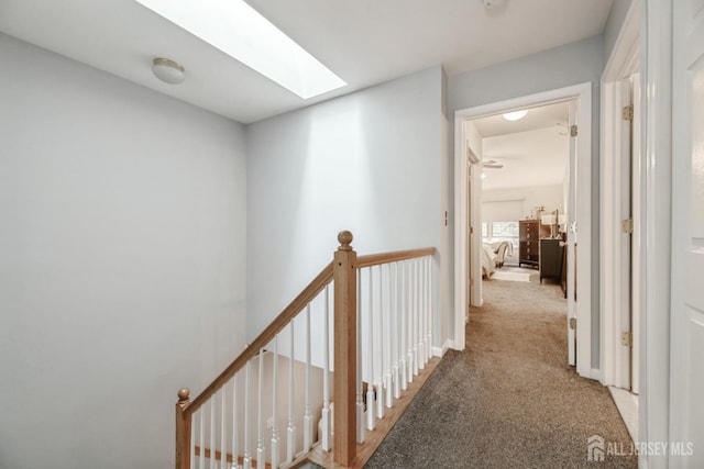 4 Linda Ct, Old Bridge, NJ 08879 - hall featuring a skylight, light colored carpet, and an upstairs landing