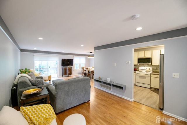 4 Linda Ct, Old Bridge, NJ 08879 - living room featuring light wood finished floors and recessed lighting