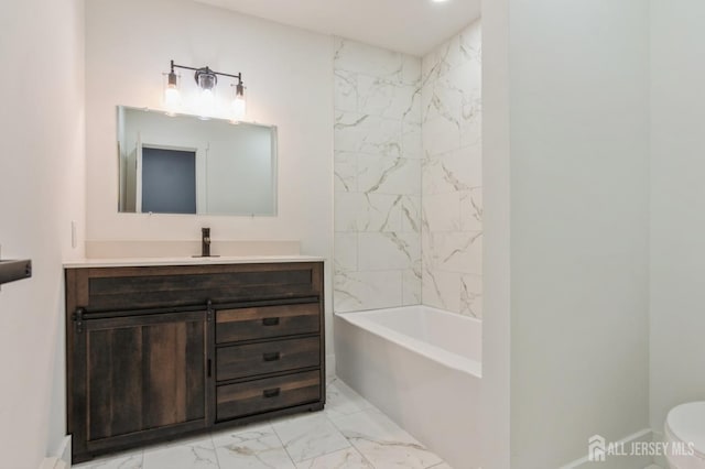 bathroom with vanity, marble finish floor, shower / bath combination, and toilet