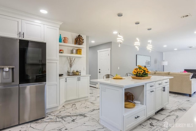kitchen with stainless steel refrigerator with ice dispenser, open shelves, marble finish floor, and light countertops