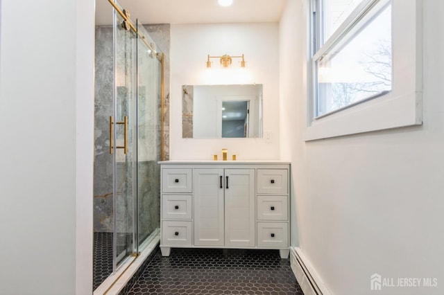 bathroom featuring a shower stall and vanity