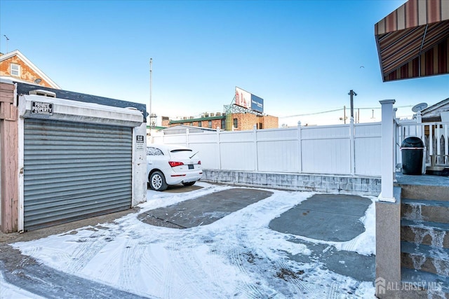 view of snow covered parking