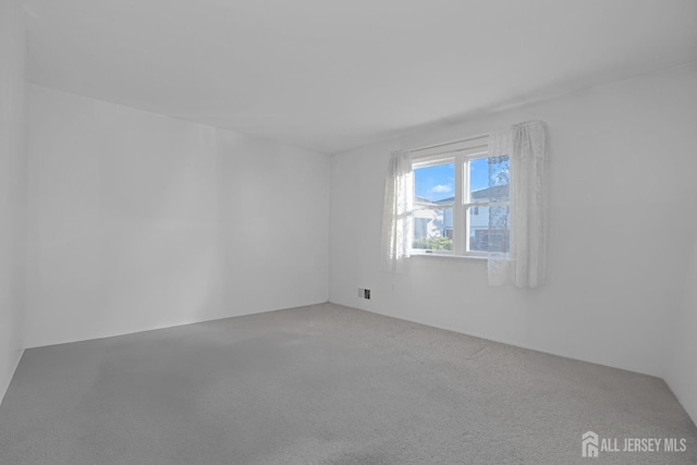 empty room featuring carpet