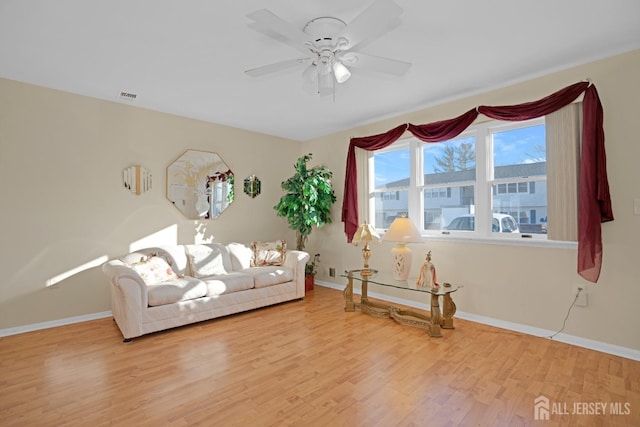 unfurnished room with hardwood / wood-style flooring and ceiling fan