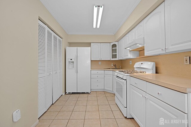 kitchen with crown molding, sink, white appliances, and white cabinets