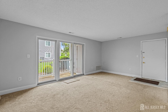 8113 Tamarron Dr, Plainsboro, NJ 08536 - carpeted spare room featuring a textured ceiling and baseboards