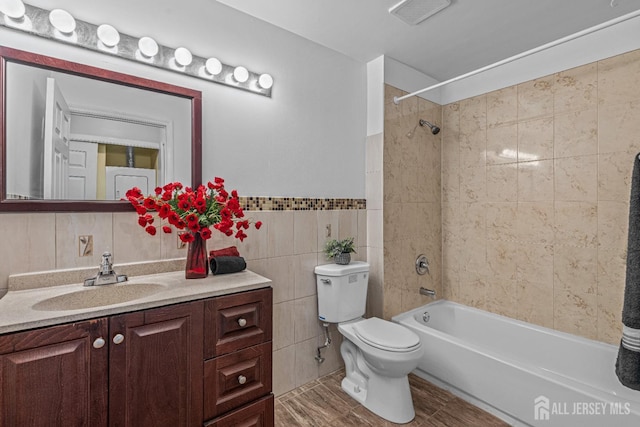 8113 Tamarron Dr, Plainsboro, NJ 08536 - bathroom featuring toilet, vanity, tile walls, and shower / bathtub combination