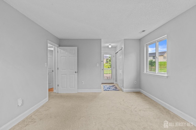 8113 Tamarron Dr, Plainsboro, NJ 08536 - unfurnished bedroom featuring baseboards, a textured ceiling, and carpet floors